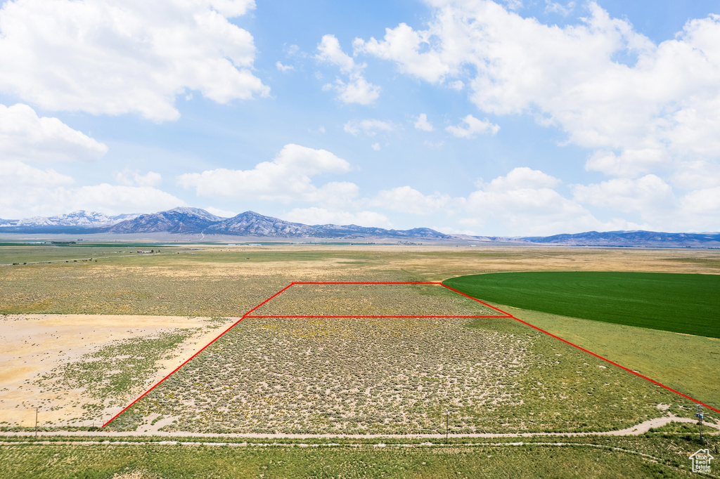 Birds eye view of property with a mountain view and a rural view