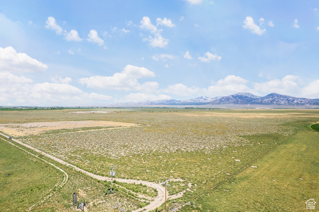 Birds eye view of property featuring a mountain view and a rural view