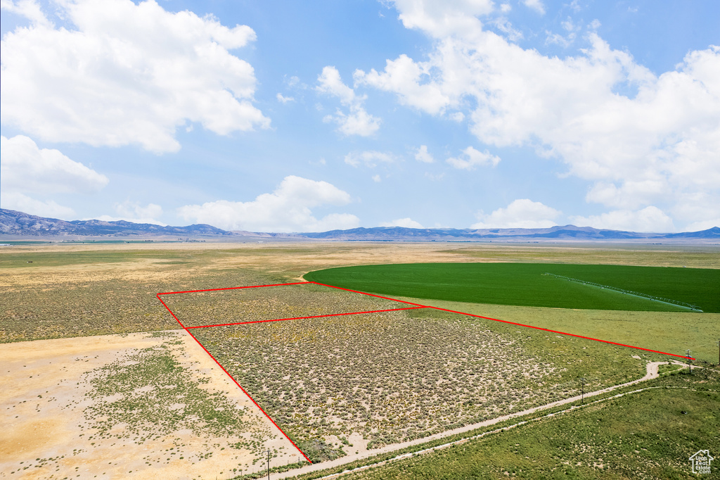 Drone / aerial view with a mountain view and a rural view