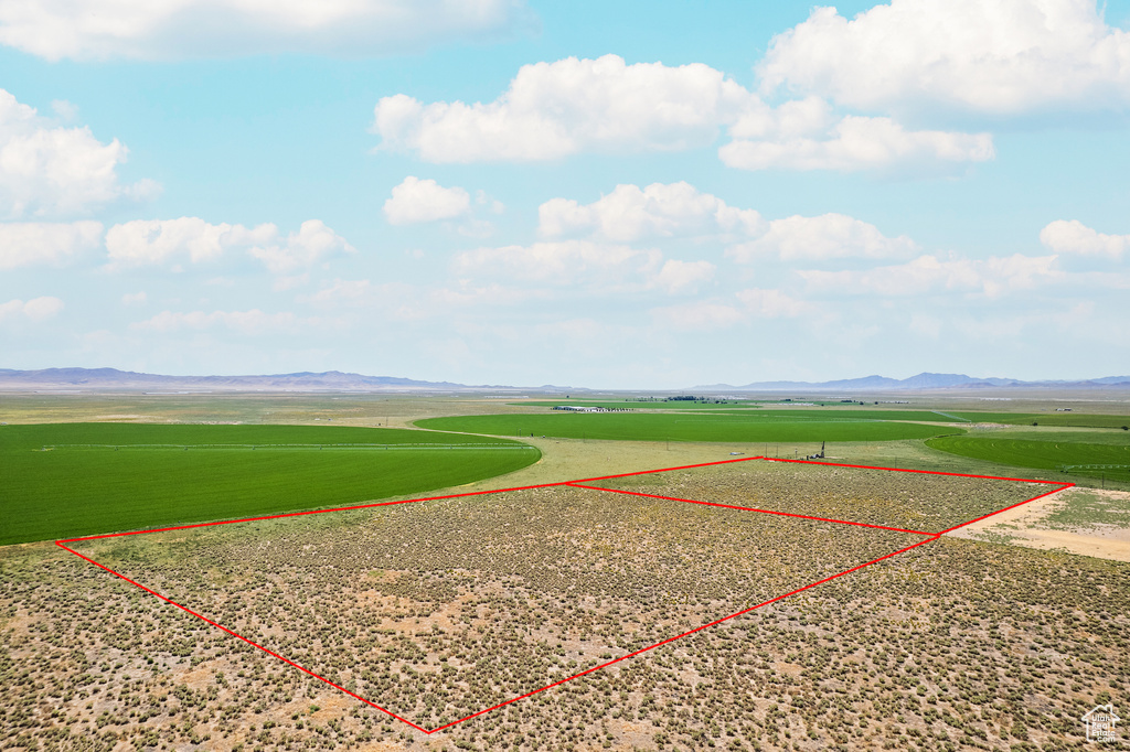 Birds eye view of property with a mountain view