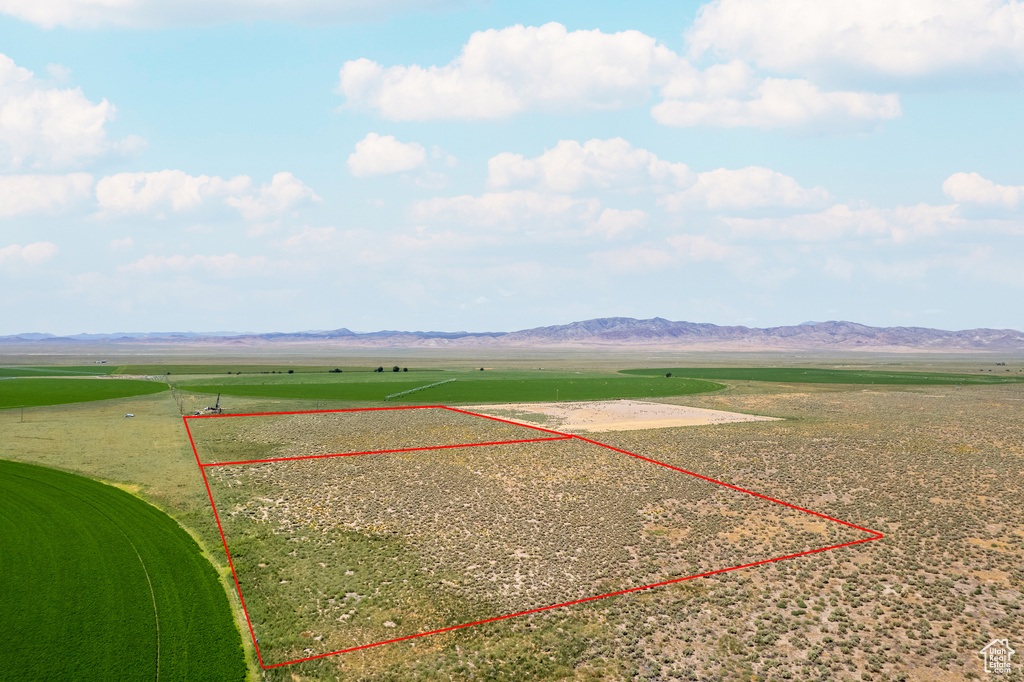 Drone / aerial view with a mountain view and a rural view