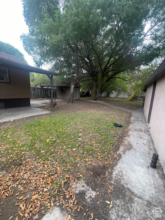 View of yard with a patio area