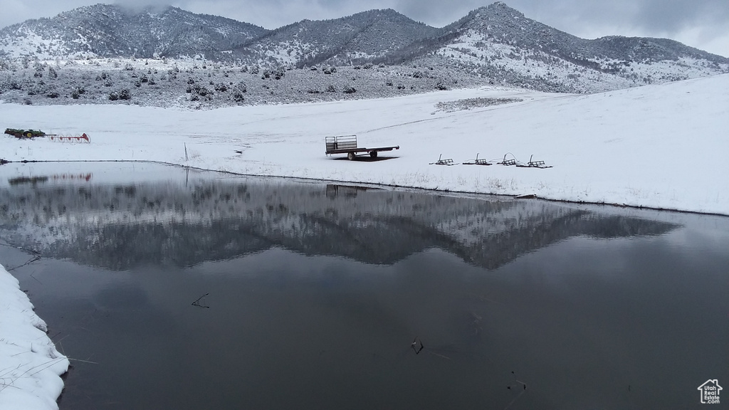 Mountain view featuring a water view