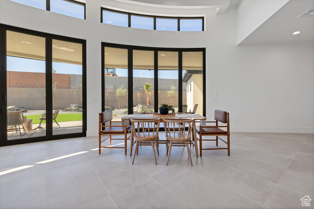 Dining room featuring plenty of natural light and light tile patterned floors