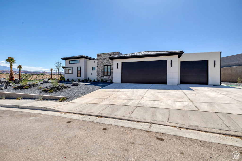 View of front of property featuring a garage