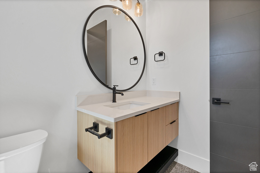 Bathroom with vanity and toilet