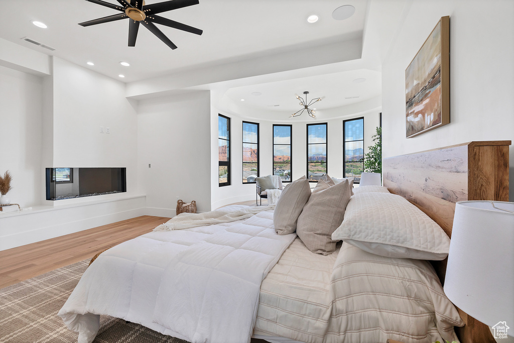 Bedroom with ceiling fan and light hardwood / wood-style floors