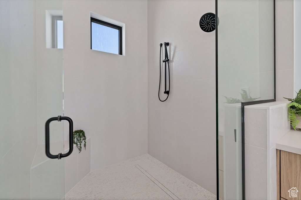 Bathroom featuring a shower with shower door