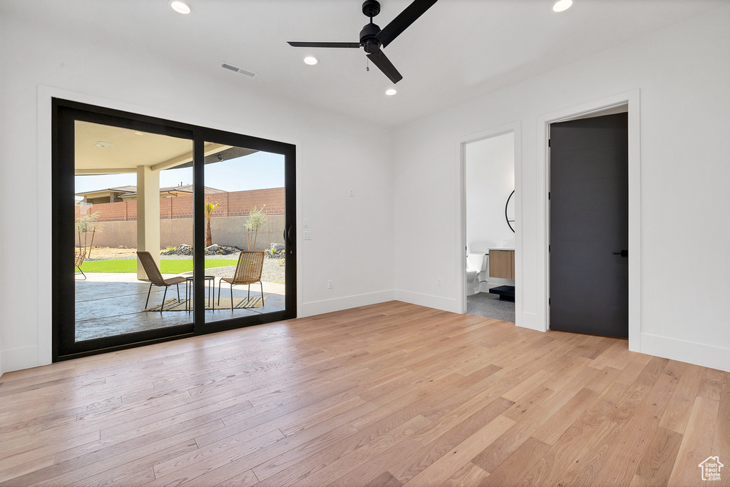 Spare room featuring ceiling fan and light hardwood / wood-style flooring