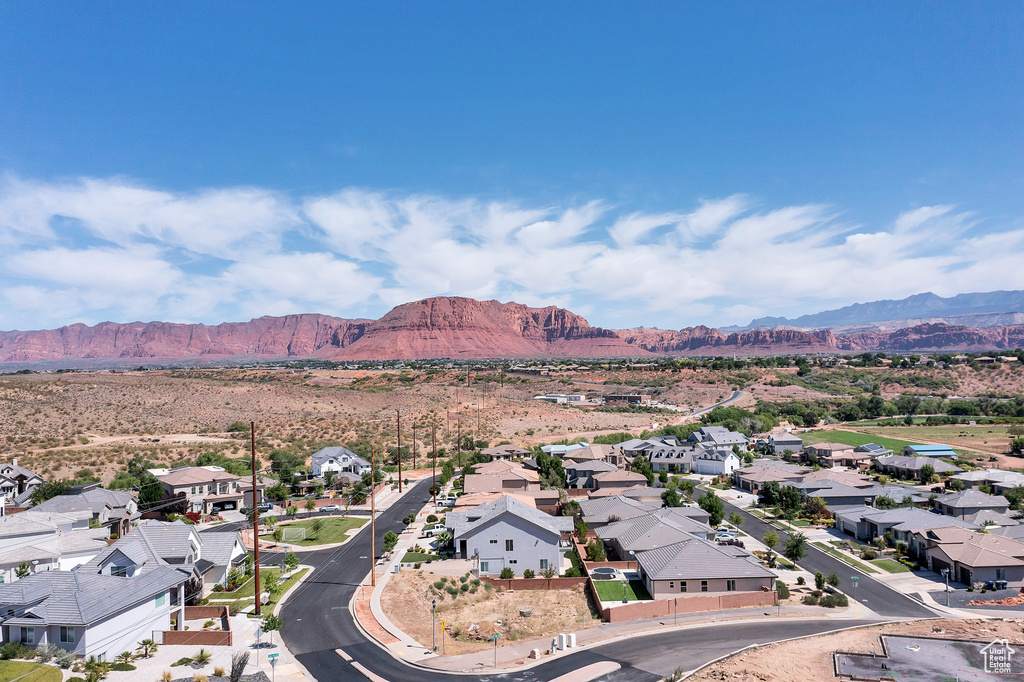 Birds eye view of property with a mountain view