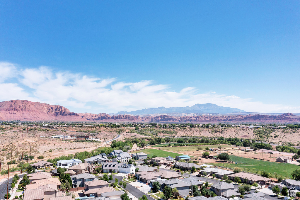 Birds eye view of property with a mountain view