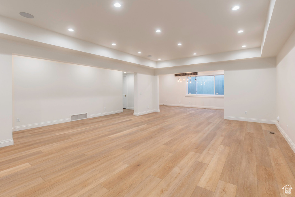 Basement featuring light wood-type flooring