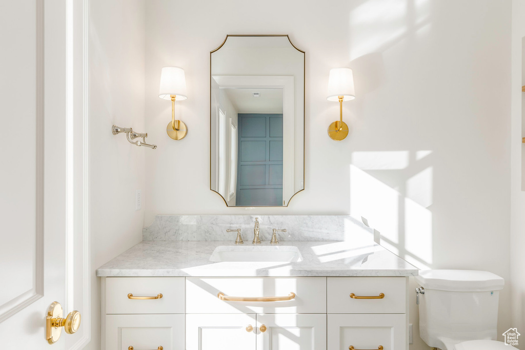 Bathroom with vanity and toilet