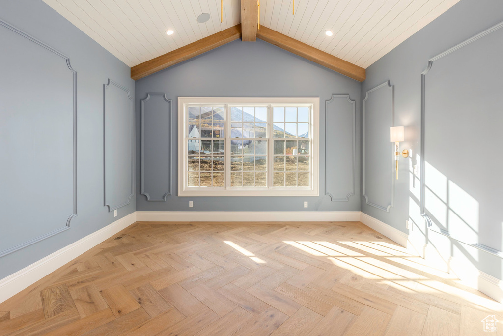 Unfurnished room with wood ceiling, light parquet floors, and lofted ceiling with beams