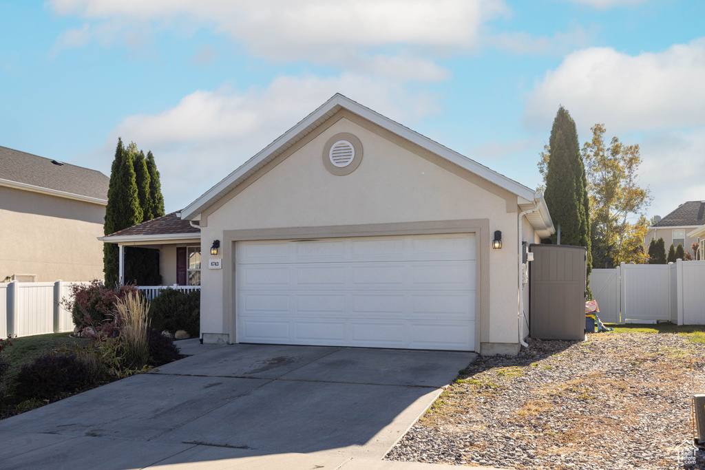 Ranch-style house featuring a garage