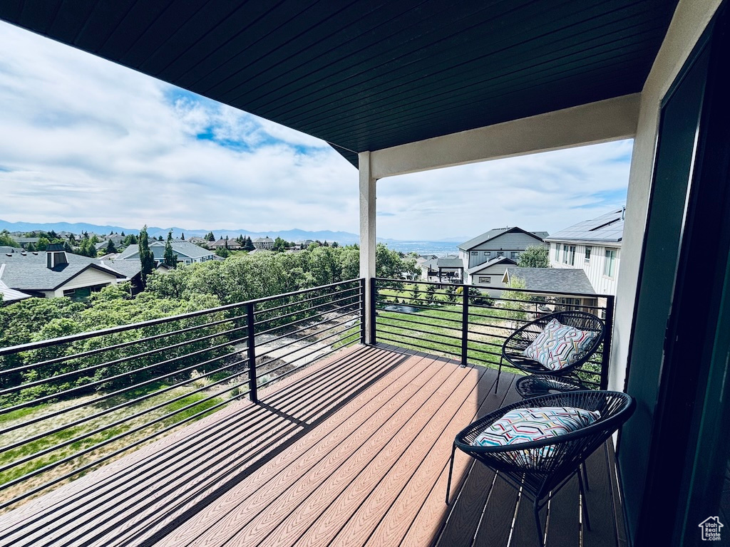 Wooden terrace featuring a mountain view
