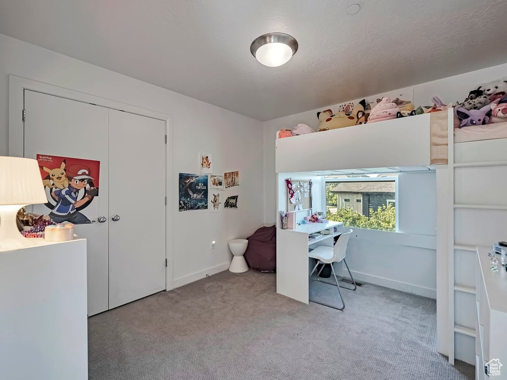 Carpeted office space with baseboards