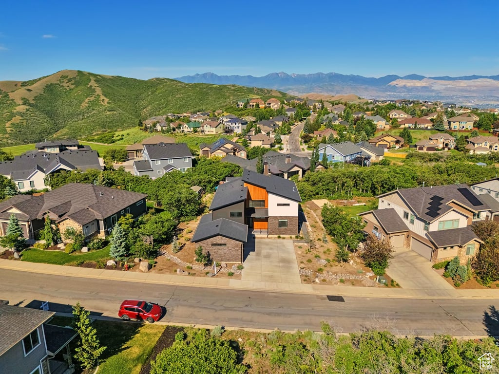 Aerial view of residential area featuring a mountain backdrop