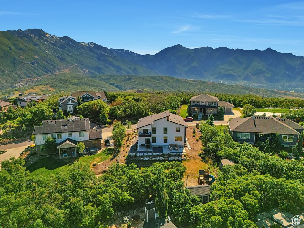 View of mountain backdrop featuring nearby suburban area