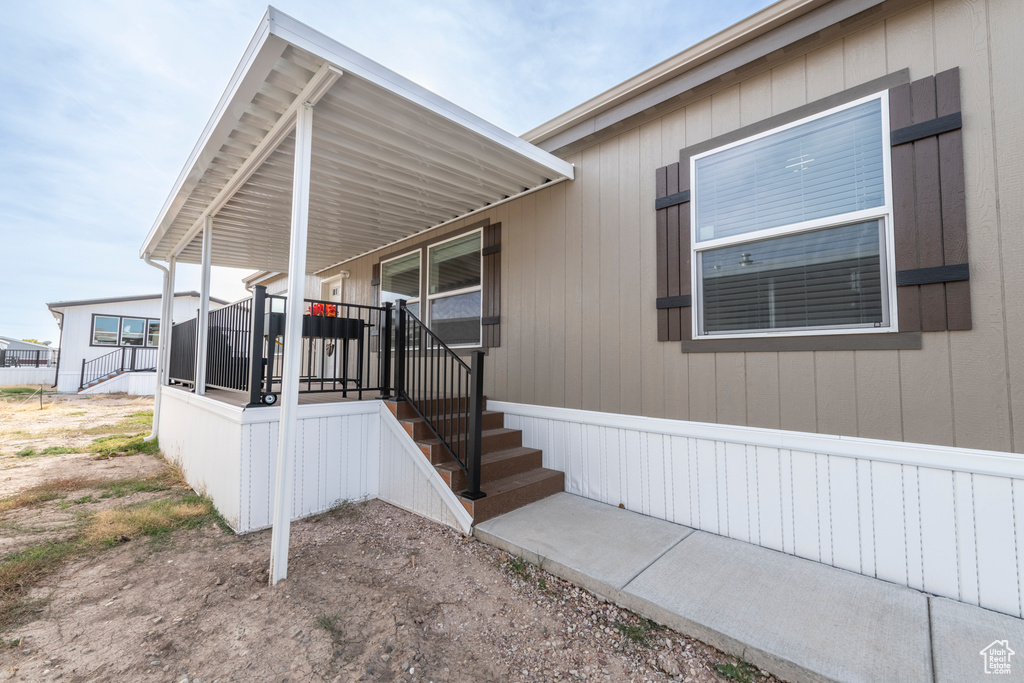 Property entrance featuring covered porch