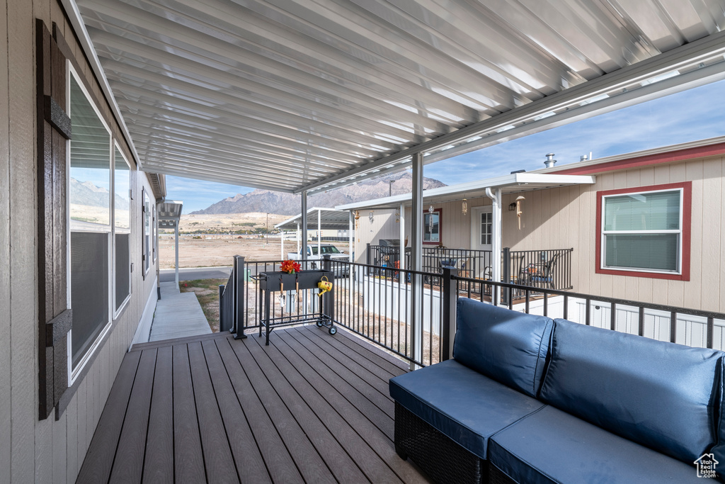 Wooden deck featuring a mountain view