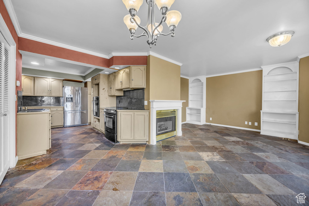 Kitchen featuring tasteful backsplash, ornamental molding, appliances with stainless steel finishes, hanging light fixtures, and a chandelier