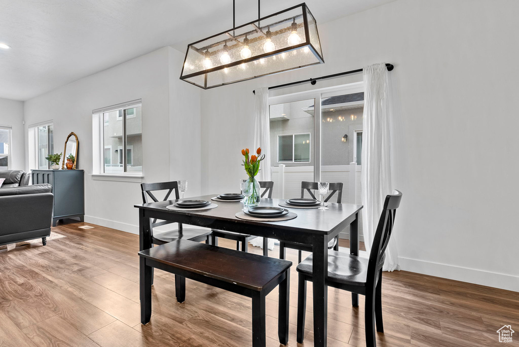 Dining space featuring hardwood / wood-style flooring