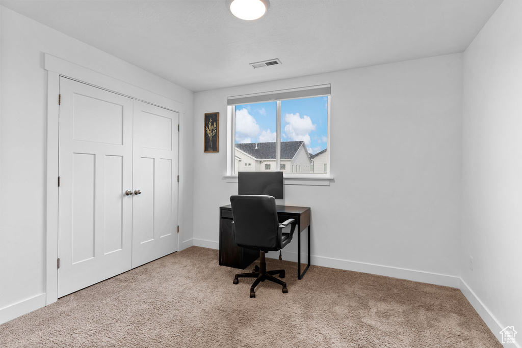 View of carpeted home office