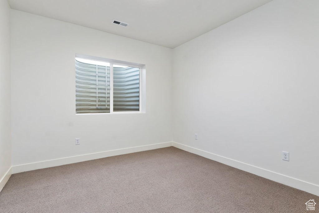Spare room featuring carpet floors