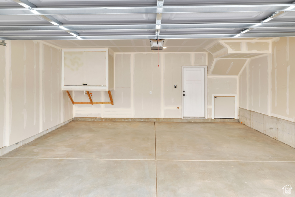 Garage featuring a garage door opener