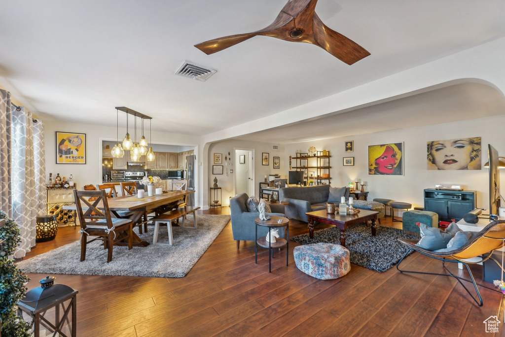 Living room with dark wood-type flooring