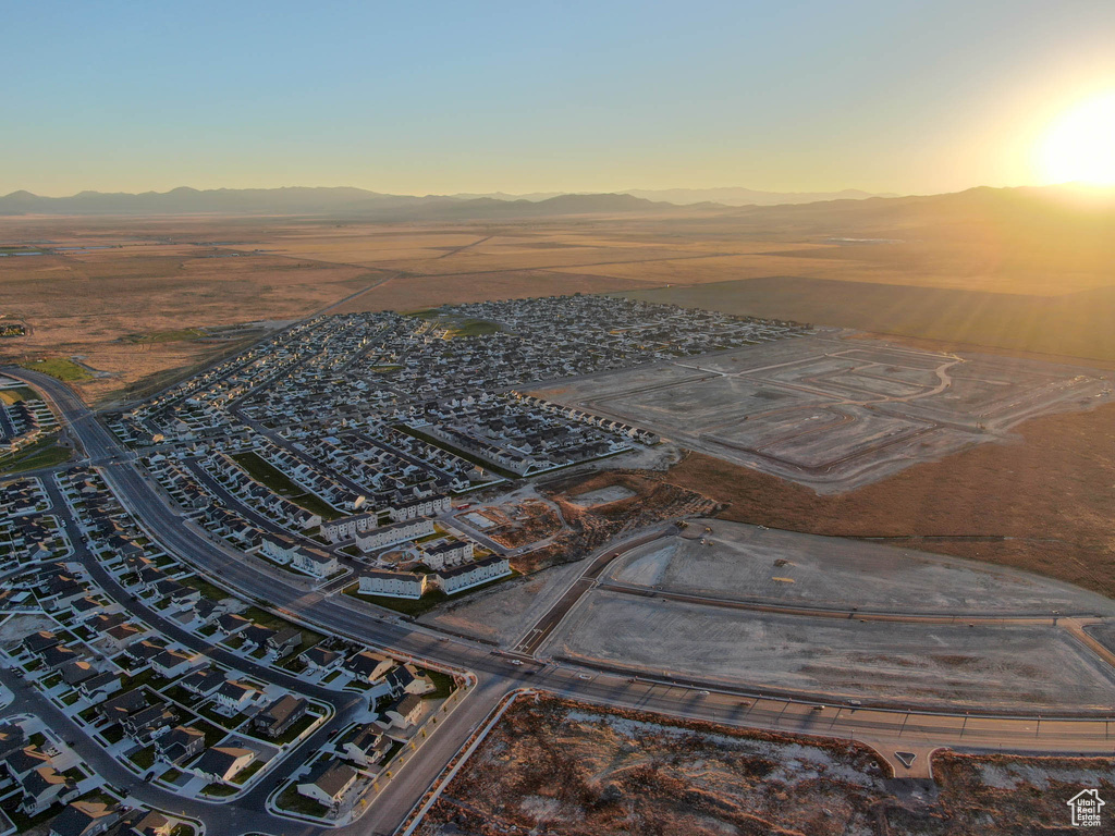 Aerial view at dusk featuring a mountain view