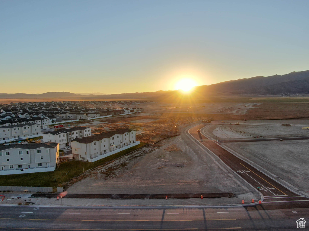 Aerial view at dusk featuring a mountain view