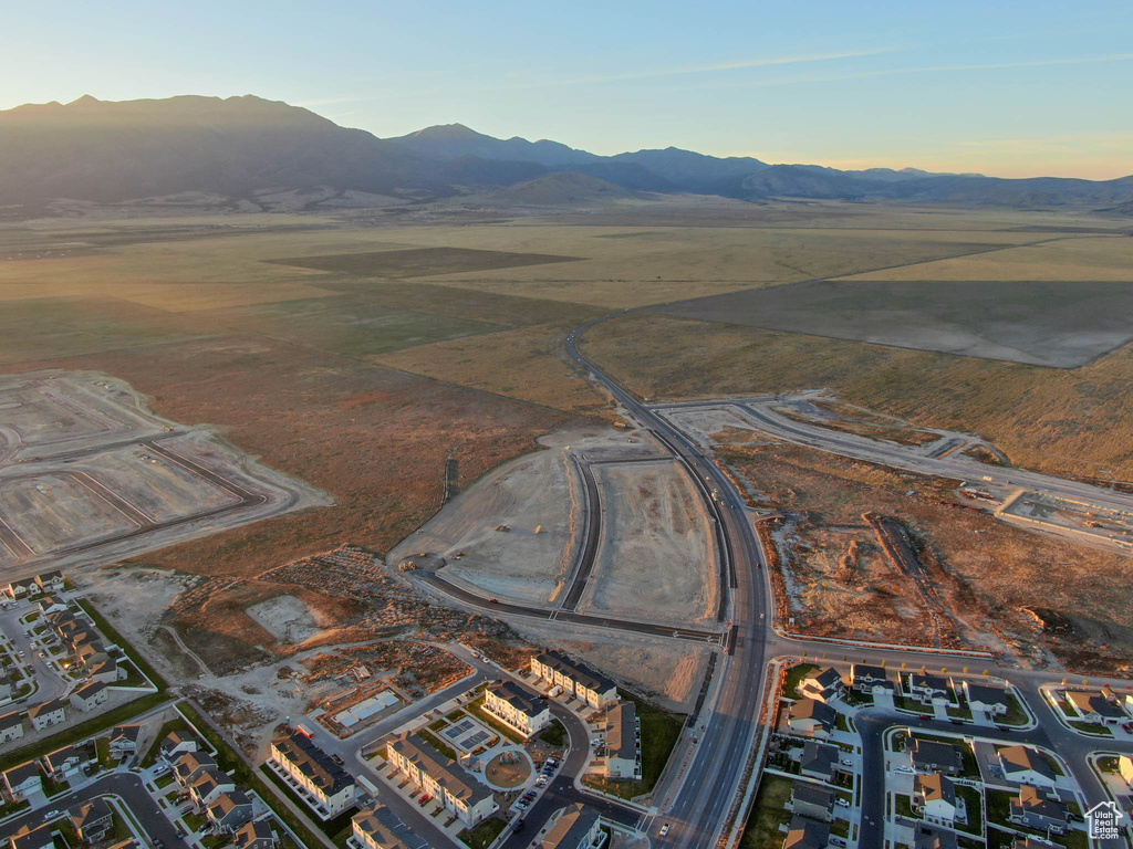 Aerial view at dusk featuring a mountain view