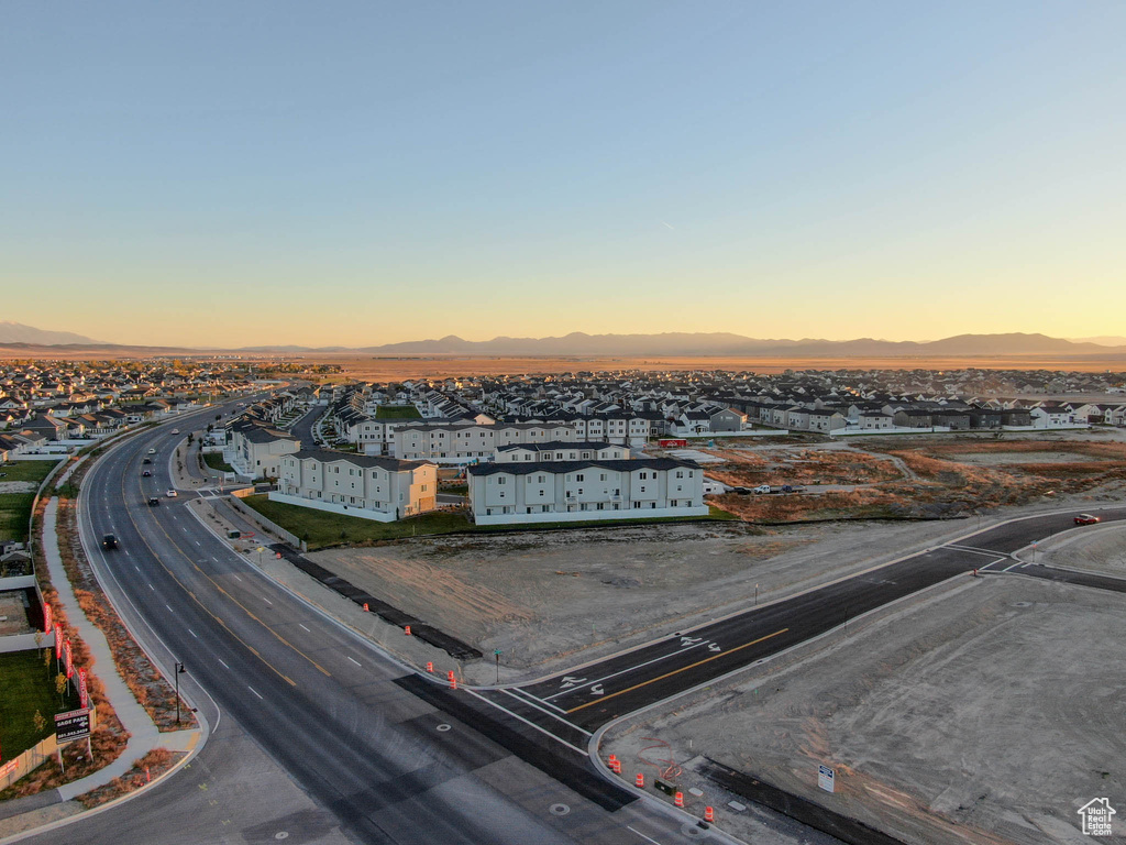 Aerial view at dusk featuring a mountain view