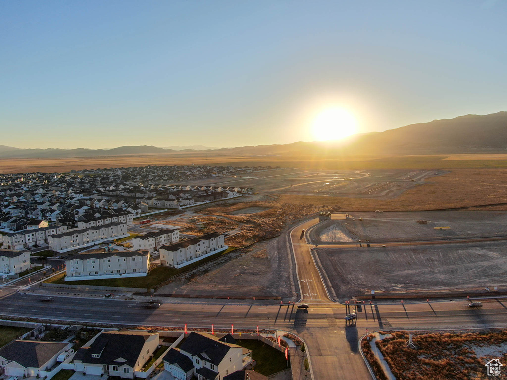 Aerial view at dusk featuring a mountain view