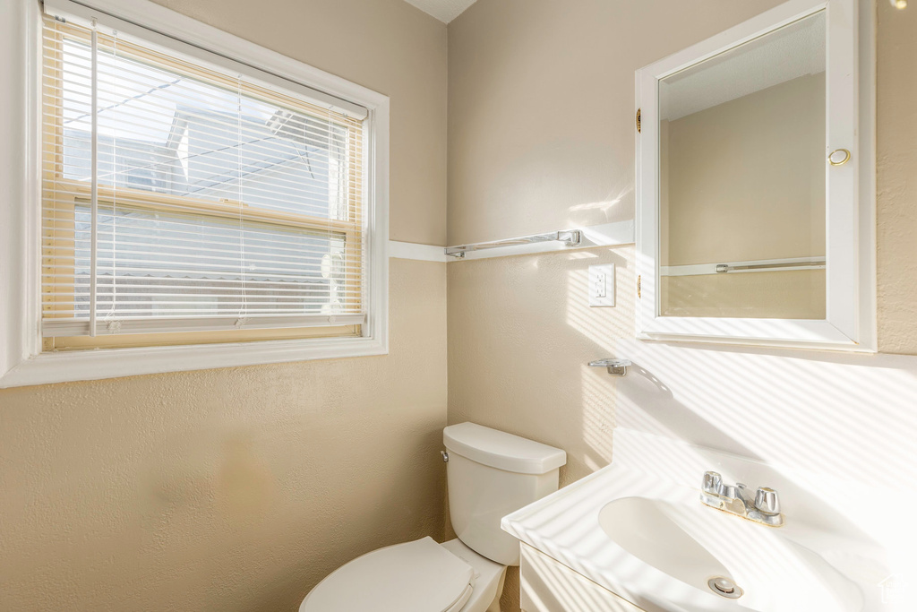 Bathroom featuring toilet and vanity