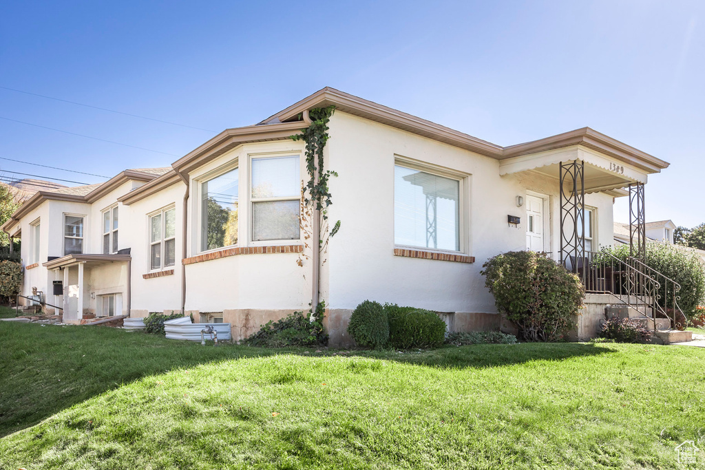 View of home's exterior with a lawn