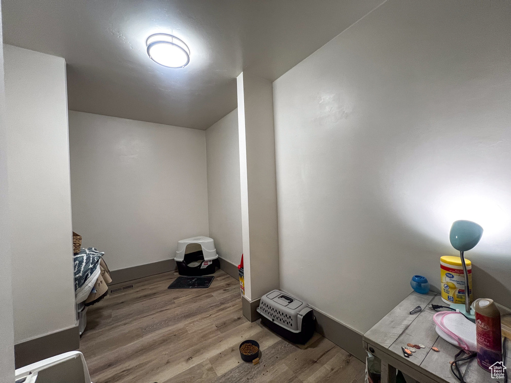 Miscellaneous room with hardwood / wood-style flooring