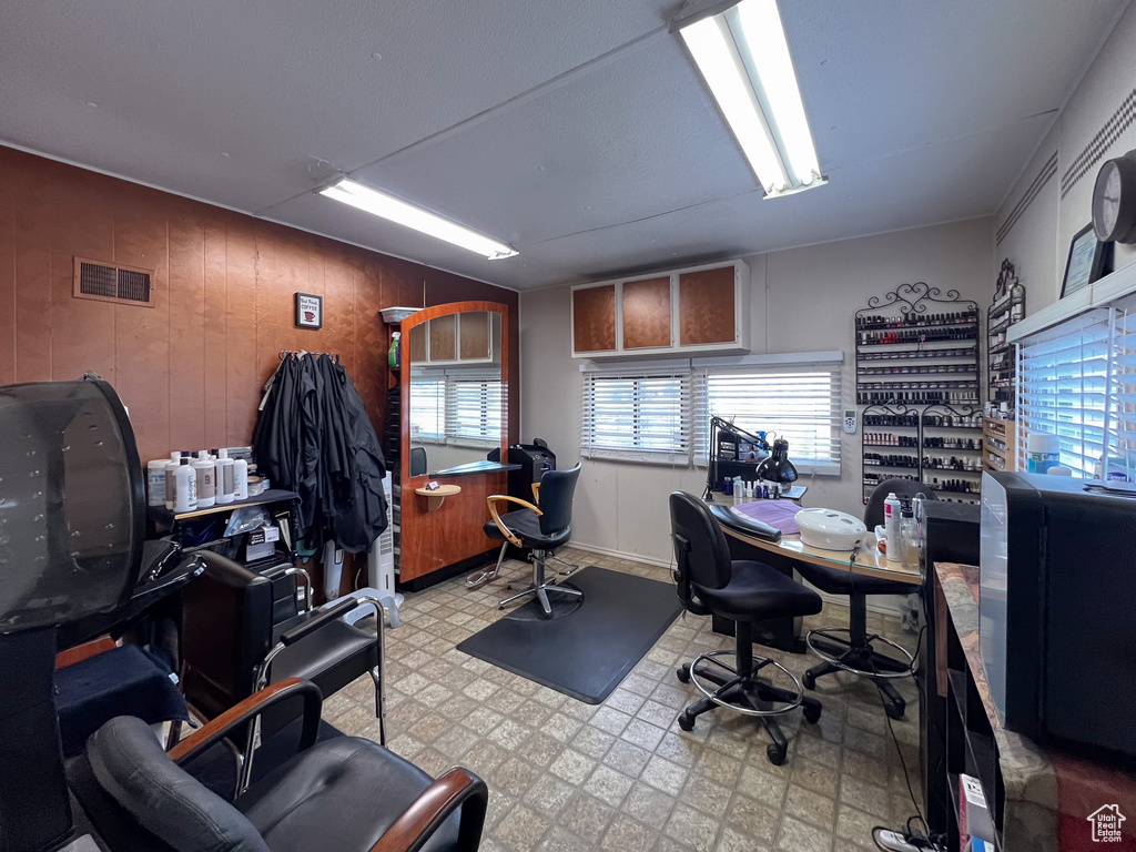 Office space featuring wooden walls