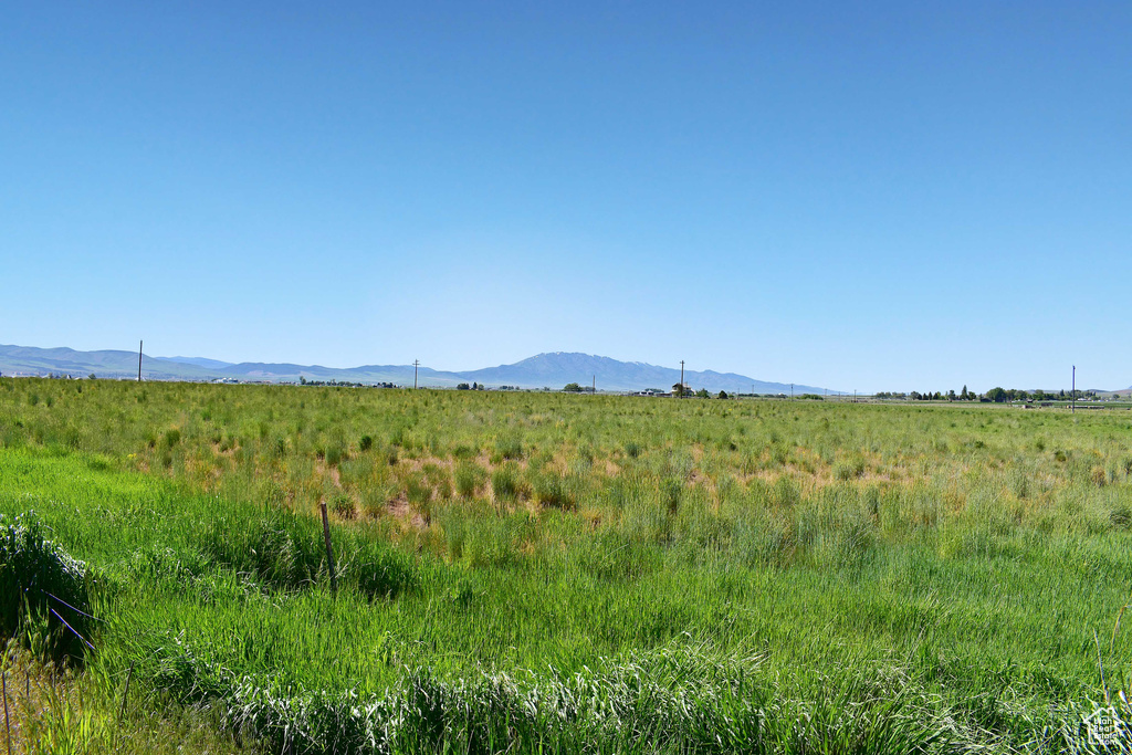 Property view of mountains with a rural view
