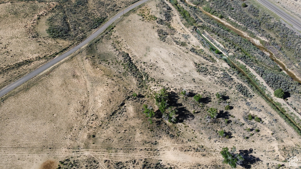 Aerial view of property and surrounding area with a desert landscape and rural landscape