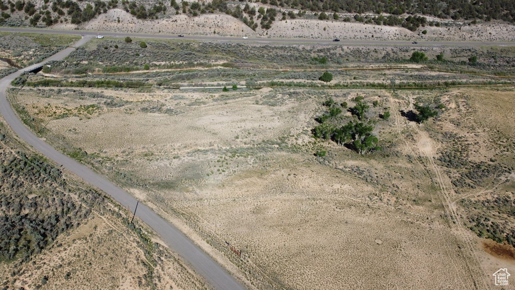 Aerial view of property and surrounding area with rural landscape and a desert landscape