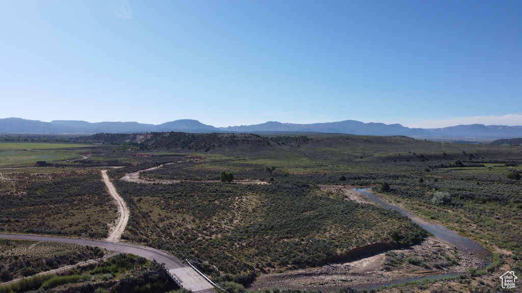 View of mountain backdrop with rural landscape