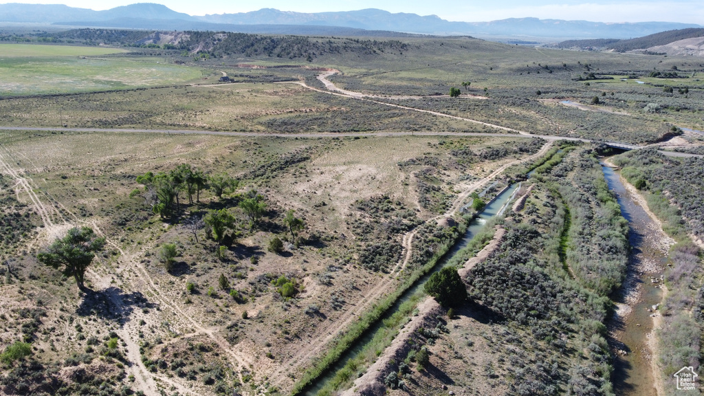 Aerial overview of property's location featuring rural landscape and mountains