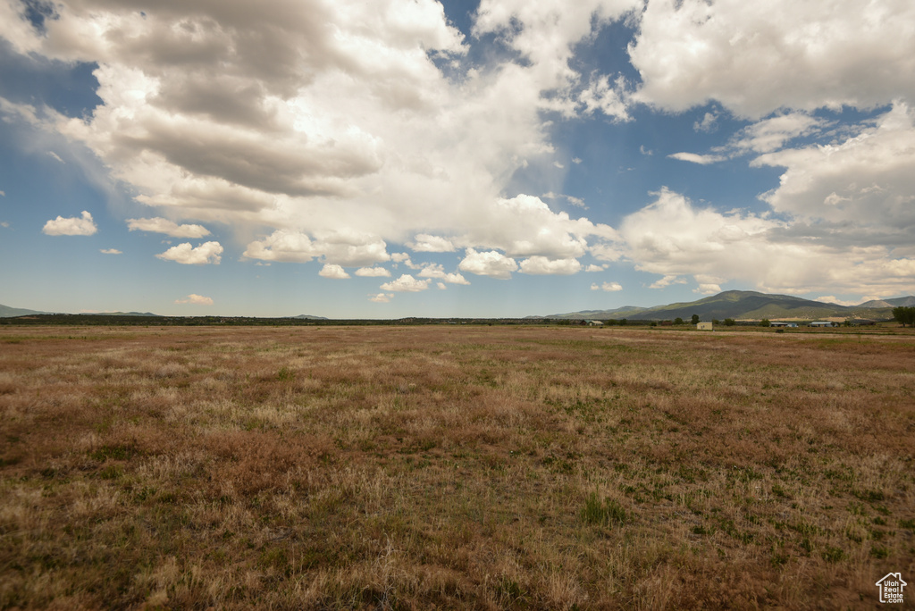 View of local wilderness with rural landscape and a mountain backdrop