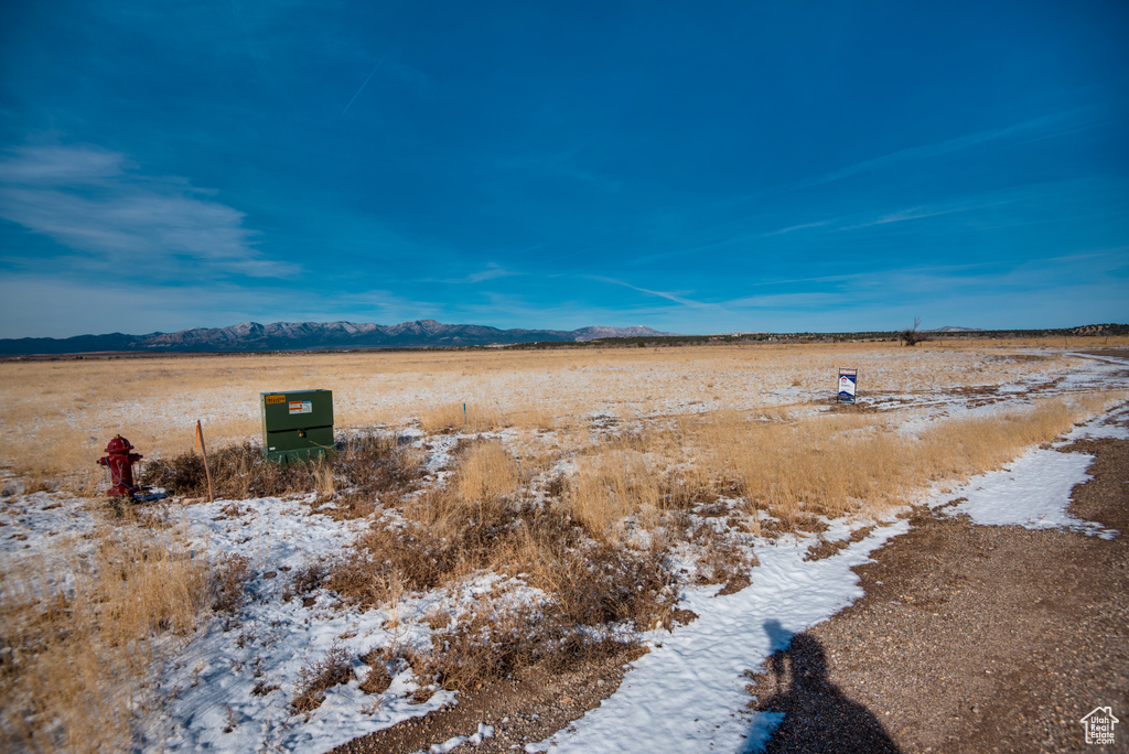 View of yard with a rural view