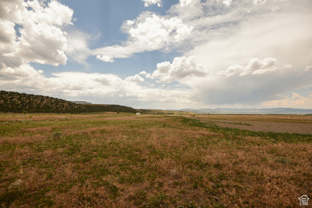 View of yard featuring a view of countryside and a mountain view
