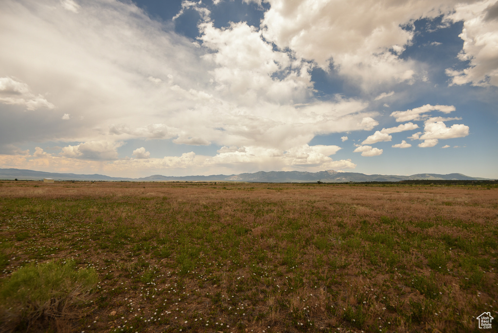 View of nature featuring a mountain backdrop and rural landscape