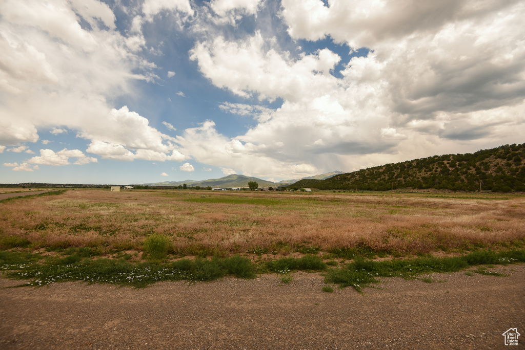 View of mountain background featuring rural landscape